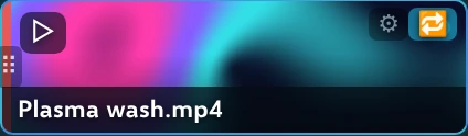 A video clip tile showing a thumbnail, the file name, a play mark, a gear and a loop badge